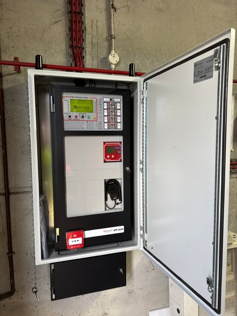 Open fire panel enclosure in plant room
